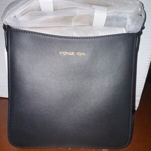 Black small crossbody Michael Kors purse